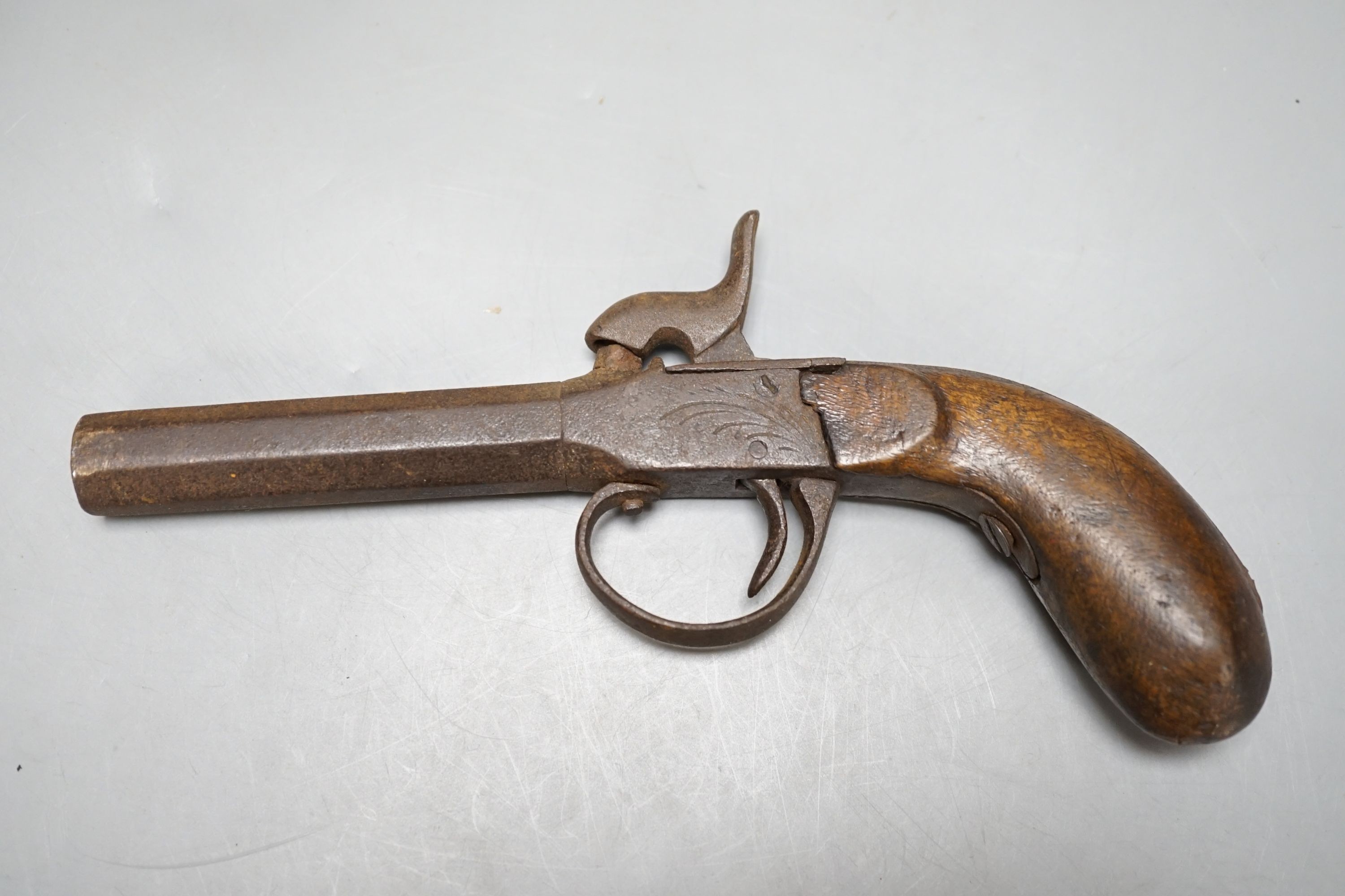 Two 19th century flintlock pistols and a pocket pistol, largest 40 cms long.